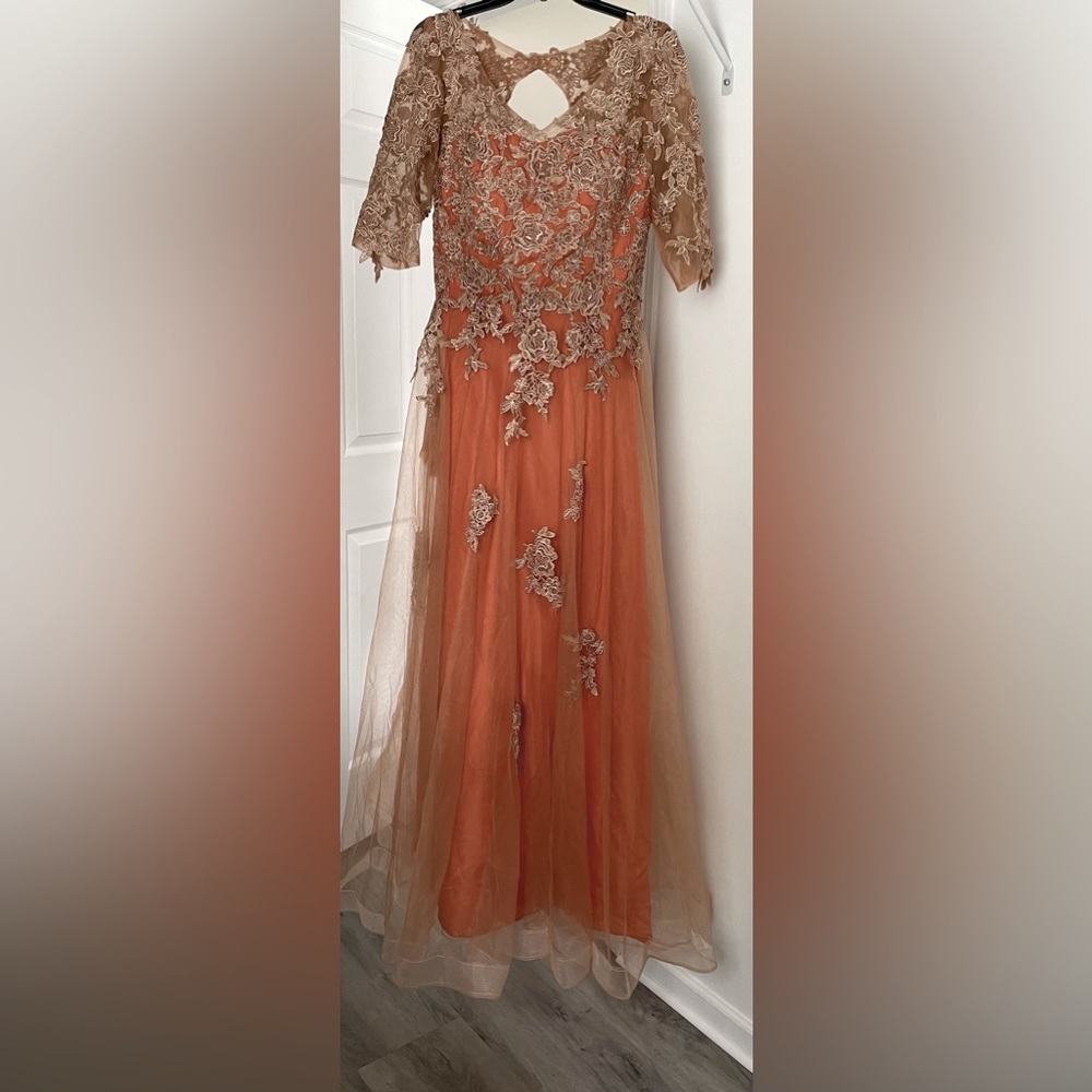 Brand new. Burnt orange. Laces up back. Has pockets. See photo measurements.